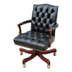 a black leather office chair with wooden arms and casteors on an isolated white background