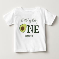 An avocado t-shirt for your baby’s first birthday. The baby shirt has a color scheme of green and white with the word "One" in large letters and a cute, smiling, avocado cartoon as the first letter of the word. Simply customize this shirt, add it to your cart, and happy birthday to your wonderful baby!

Avocado One 1st First Birthday Baby T-Shirt
Sweetsham Food Art | ©Melissa Patton - Artist/Illustrator Personalized Green Cotton Tops, Cute Green Tops With Name Print, Personalized Green Short Sleeve Tops, Green Summer Top For Birthday, Green Short Sleeve Shirt For Birthday, Green Letter Print Top For Birthday, Birthday Letter Print Green Shirt, Green Tops With Name Print For Birthday, Green Casual Top For First Birthday