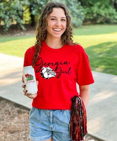 Show your state and team pride with this adorable Georgia Girl Shirt! From tailgating to football parties this will be your go to shirt this season! Super cute paired with shorts, jeans, or white skinny jeans!   * 6.0 oz., pre-shrunk 100% cotton* Double-needle stitched neckline and sleeves* Quarter-turned* Seamless seven-eighths inch collar* Taped neck and shoulders* Satin label* Rib cuffs White Casual Top For Tailgating, Casual White Top For Tailgating, School Spirit Tops For Football Season Tailgating, School Spirit Tops For Tailgating During Football Season, Sporty Short Sleeve Tops For Tailgating, Casual Tops With Team Name For Tailgating, School Spirit T-shirt For Game Day In Spring, Short Sleeve Sports Fan Tops For Tailgating, Sports Fan Short Sleeve Top For Tailgating