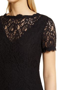 A lacy overlay adds stylish definition to an elegant and sophisticated cocktail dress styled with a ruffled skirt and pretty scalloped details. 38" length Hidden back-zip closure Bateau neck Short sleeves Lined 70% cotton, 30% nylon Dry clean Imported Women's Clothing Elegant Evening Dresses With Scalloped Edges, Elegant Lace Dress With Scalloped Edges For Evening, Elegant Evening Lace Dress With Scalloped Edges, Lace Evening Dress With Scalloped Edges, Chic Evening Dress With Scalloped Edges, Sheath Lace Dress With Lace Trim For Evening, Fitted Dresses With Delicate Lace For Evening, Fitted Lace Top With Scalloped Edges, Elegant Fitted Dress With Scalloped Edges