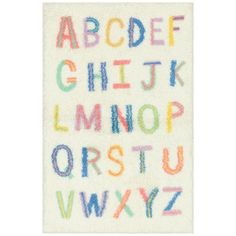 the alphabet is made out of colored crayons on a white surface with multicolored letters