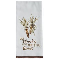 a kitchen towel that says give thanks with a grateful heart and two corn cobs