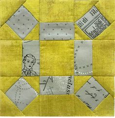 a yellow and gray patchwork quilt with some pictures on the front, along with words written in small squares