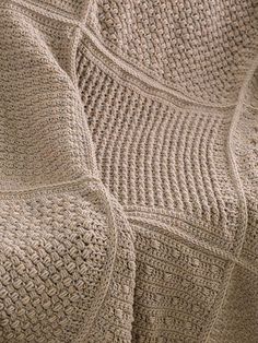 a close up view of a crocheted blanket