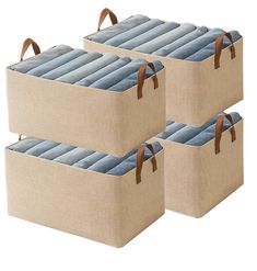 three canvas storage bins with handles and straps