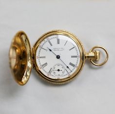 This is a very old 14 k gold pocket watch made by the American Waltham Co. in Waltham, Massachusetts. Waltham made some of the earliest American watches. This piece was made sometime between 1850 and 1957. This pocket watch has seen some American history! It has beautiful delicate engraving around the case and on both sides. 34mm diameter = 1.5". With the ring, it is 2" tall.  It is 10mm deep and weighs 34g. Marked A.W.C. Co. 73485 Engraved inside the back: M.C S. -1897- Heirloom Round Pocket Watch With Chronometer, Heirloom Yellow Gold Medallion Pocket Watch, Gold Pocket Watch With Subdials For Collectors, Vintage Yellow Gold Pocket Watch With Subdials, Timeless Gold Pocket Watch Collectible, Victorian Style Gold Watch With Chronometer, Heirloom Yellow Gold Pocket Watch With Chronometer, Heirloom Round Chronometer Pocket Watch, Antique Gold Watches With Chronometer