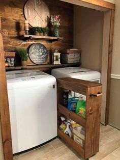 a small kitchen with a washer and dryer in the corner next to a wall mounted clock