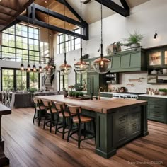 a large kitchen with wooden floors and green cabinets