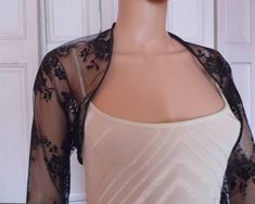 This is a beautiful hand made dark blue lace shrug ideal for weddings or special occasions. The shrug has a navy blue satin edging. It can also be worn with casual wear. It can be made in any size from 8 to 24 (UK sizes). It is made in the UK. It is normally sent out to you within 5 days, but I am very happy to make your order a priority if you need it urgently. Just let me know the date needed by. Postage is free in the UK! International postage is £9. I am happy to exchange items or refund you Spring Party Lace Shrug, Spring Party Shrug With Lace Trim, Party Shrug With Lace Trim, Evening Shrug With Lace Trim, Fitted Shrug With Lace Sleeves For Spring, Spring Fitted Shrug With Lace Trim, Fitted Party Shrug With Lace Trim, Fitted Lace Trim Shrug For Party, Fitted Lace Trim Party Shrug