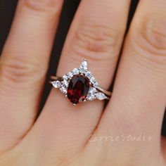 Marquise Ruby Ring With Halo Setting As Gift, Marquise Garnet Ring For Anniversary, Burgundy Ruby Ring For Wedding, Elegant Red Marquise Cut Birthstone Ring, Burgundy Ruby Wedding Ring, Elegant Marquise Cut Red Ring, Elegant Red Marquise Birthstone Ring, Elegant Red Marquise Cut Ring, Silver Marquise Cut Ruby Jewelry