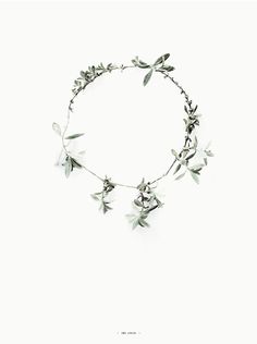 a necklace with green leaves on it