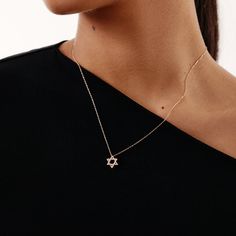 "This diamond star of david necklace in 14k solid gold is the perfect way to express your beliefs your style. The gold star of david pendant, with its beautiful dainty design, showcases your love for your faith and heritage in a subtle way.  F E A T U R E S  * Diamond Quality: Diamond carat: 0.08 ct. Clarity: VS2 Color: F-G Cut: Excellent cut Diamond type: Natural Diamond Setting Type: Prong Setting  * Gold Carat: 14K  * Choice of Gold Color: Yellow Gold, Rose Gold, White Gold  * Pendant Height: Minimalist 14k Gold Star Of David Necklace, Minimalist Yellow Gold Star Of David Necklace, Gold Star Pendant, Star Of David Necklace, The Star Of David, Star Of David Pendant, White Gold Pendant, Star Pendant Necklace, Diamond Star