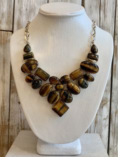 Tiger Eye is mesmerizing with its shimmering bands of yellow-brown to golden color -21 inch necklace with 2 1/2 inch drop -.925 overlay sterling silver -adjustable length with toggle closure   Originally $258. On limited time SALE Brown Jewelry With Adjustable Chain For Jewelry Making, Elegant Brown Jewelry With Adjustable Chain, Elegant Brown Necklace With Stones, Unique Brown Jewelry With Adjustable Chain, Elegant Brown Necklace With Polished Finish, Unique Brown Sterling Silver Necklaces, Luxury Brown Jewelry With Natural Stones, Luxury Handmade Brown Necklaces, Luxury Handmade Brown Necklace