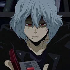 an anime character with blue hair and red eyes holding a game controller in his hand