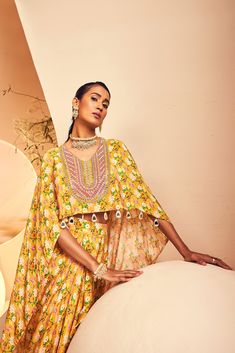 featuring a high-low top paired with a draped dhoti skirt in a modern floral print. The neckline is embroidered fully by hand with intricate Japanese cutdana and bead embroidery. From Aneesh Agarwaal's Naksh collection. DELIVERY TIMEPlease allow 8-12 weeks for your outfit to arrive. FABRIC DETAILSCrepe Professional cleaning only. Designer Embroidered Neckline Dress For Diwali, Traditional Anarkali Set With Embroidered Neckline For Eid, Traditional Eid Anarkali Set With Embroidered Neckline, Traditional Sets With Embroidered Neckline For Navratri, Diwali Straight Kurta Dress With Embroidered Neckline, Diwali Festival Straight Kurta With Embroidered Neckline, Festive Anarkali Dupatta With Embroidered Neckline, Traditional Sets With Embroidered Neckline For Diwali, Festive Silk Sets With Embroidered Neckline