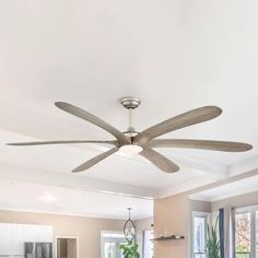 a ceiling fan in the middle of a living room