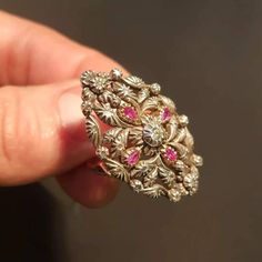 "RING SIZE: 7.5 US 56 EU GOLD: 14 ct. WEIGHT: 11.70 grams SIZE: 35 mm x 23 mm RUBIES: authentic, 0.35 ct. DIAMONDS TOTAL WEIGHT: 0.40 ct CUT: pink cut, in the center is an old European diamond COLOUR: K CLARITY: Si2 CONDITION: EXCELLENT Stunning Art Deco style diamond and ruby ring with a beautiful floral design. The ring features 14 carat gold Hungarian \"fox heads\" from 1867 to 1922. Rose cut diamonds and one old european cut Si2 clarity and K color total 0.40 ct and uncut, genuine rubies 0.3 Art Deco Gold Ruby Ring, Antique Gold Rings With Diamond Cut, Antique Gold Diamond Cut Rings, Ornate Gold Rings With Rose Cut Diamonds, Gold Ruby Rings With Intricate Design, Ornate Gold Ring With Rose Cut Diamonds, Gold Ruby Rings With Diamond Cut, Ornate Gold Diamond Ring With Rose Cut, Ornate Yellow Gold Ruby Ring With Intricate Design