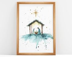 a watercolor painting of a manger scene with a baby jesus in the manger