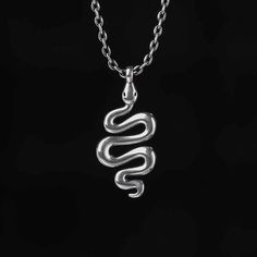 Snakes have always played an integral role in religion, mythology, and literature. The snake necklace, in polished sterling silver, calls on the inner wisdom of its wearer; reminding them with each new day, they have the opportunity to rebirth into the best versions of ourselves.Material: Plating Color: Length: 450 mm Spiritual Snake-shaped Necklace For Gifts, Silver Spiritual Snake Chain Jewelry, Spiritual Silver Snake Chain Jewelry, Spiritual Sterling Silver Snake Chain Jewelry, Silver Symbolic Snake-shaped Necklace, Silver Snake Necklace With Symbolic Style, Symbolic Sterling Silver Snake Chain Necklace, Symbolic Sterling Silver Snake Chain Jewelry, Silver Spiritual Snake Necklace