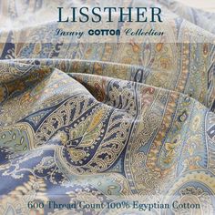 an image of a blue and green paisley pattern on the cover of a bed sheet