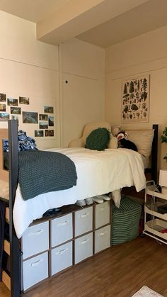 a bedroom with a bed, desk and storage bins on the bottom bunk beds