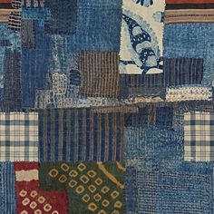 a patchwork quilt with many different colors and patterns on it's sides, including blue