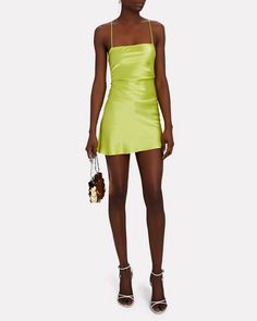 Cut from vivid green silk charmeuse the label's Suna mini dress channels '90s minimalism with a slip silhouette that reveals a sultry lace-up back.   Fabric: 100% silk.   Lace-up back closure.   Imported.       Length from shoulder to hem: 35".   Model is wearing size P.  Model height 5'10", bust 30", waist 23", hips 33". Bias Cut Mini Dress For Date Night, Fitted Green Slip Dress For Cocktail, Green Fitted Slip Dress For Cocktail, Summer Cocktail Mini Dress With Boning, Backless Silk Mini Dress For Summer, Spring Mini Dress With Boning, Green Backless Slip Dress For Evening, Summer Silk Backless Mini Dress, Fitted Satin Square Neck Summer Dress