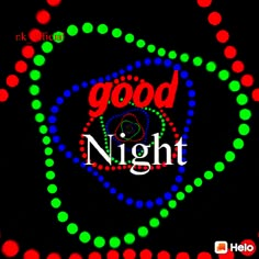 the words good night are lit up in red, green, and blue circles on a black background