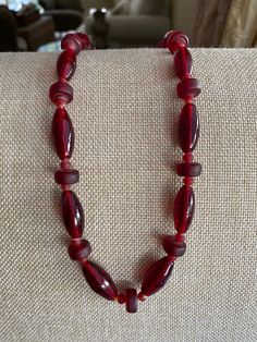 Czechoslovakia Glass Deep Red 20" Vintage Beaded Necklace Lovely made with 3 different shaped beads creating a lovely style Necklace! Metal ends and clasp  Light weighed around 2.3oz. Lovely piece to own! Thank You For Visiting :) ** I Ship Out Same Day **All questions encouraged and additional photographs will be sent upon request! Please ask all questions and thoroughly check each picture and description as ALL SALES ARE FINAL** Red Carnelian Single Strand Necklace, Red Carnelian Jewelry With Faceted Beads, Handmade Red Oval Necklace, Handmade Red Carnelian Beaded Necklaces, Red Carnelian Necklace With Faceted Beads, Red Carnelian Beaded Necklace With Faceted Beads, Red Carnelian Faceted Beaded Necklaces, Red Vintage Hand-strung Jewelry, Red Carnelian Beaded Necklace Hand-strung