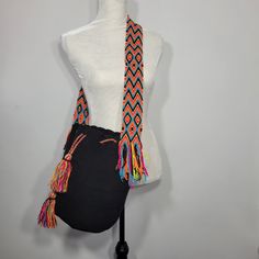 100% Handwoven By The Artisans Of The Colombian Wayuu Tribe Crossbody Bucket Bag; Strap Can Be Knotted For Shoulder Bag Style. Drawstring Closure, With Tassels With Side Fringe Color: Black With Multi Color Fringe And Strap With Orange, Teal, Black, Pink, Yellow Material: Acrylic Approximate Bag Dimensions: Length 11.5" Height 11.25" Strap Drop 19" **(Each Bag Is Unique And Can Vary By 1 Inch Or So.)** All Wayuu Bags Are Handmade, Unique In Color & Design Casual Black Shoulder Bag With Long Strap, Black Beach Bag With Detachable Strap, Black Adjustable Crossbody Shoulder Bag, Adjustable Black Crossbody Shoulder Bag, Black Woven Crossbody Bucket Bag, Black Woven Crossbody Shoulder Bag, Black Crossbody Bucket Bag For Beach, Black Bags With Removable Pouch For Festival, Black Bohemian Bag With Detachable Strap