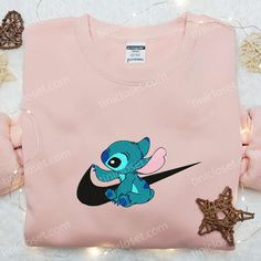 Stitch x Swoosh Embroidered Sweatshirt, Disney Characters Embroidered Hoodie, Best Gift Ideas for Family Welcome to the enchanting world of Tinicloset, where every thread tells a story and your wardrobe becomes a canvas for creativity! Our store is a delightful haven for those seeking custom embroidered apparel that fuses the charm of Disney with the... Disney Cartoon Print Hooded Sweatshirt, Disney Long Sleeve Sweatshirt With Character Print, Disney Character Print Long Sleeve Sweatshirt, Disney Hooded Sweatshirt With Cartoon Print, Disney Cotton Hoodie With Character Print, Disney Crew Neck Sweatshirt With Embroidered Logo, Disney Cotton Hooded Sweatshirt, Cotton Disney Hooded Sweatshirt, Disney Long Sleeve Sweatshirt For Streetwear