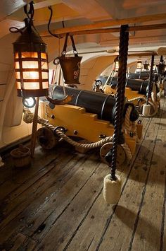 the inside of a boat with ropes and lights