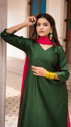 Bring on the festive spirit with our kurta set in chanderi silk. Fully lined kurta and pants. Made in chanderi silk. Dupatta in mul cotton with intricate tikki details. Color of Kurta + Pants : Dark Green. Color of Dupatta : Rani Pink. Model height is 5.3” and is wearing a size S. Wash Care : Dry Clean Only Slub Silk Kurta With Cutdana For Diwali, Semi-stitched Slub Silk Kurta For Transitional Seasons, Transitional Semi-stitched Slub Silk Kurta, Straight Kurta In Raw Silk With Cutdana, Raw Silk Kurta With Cutdana For Diwali, Straight Raw Silk Kurta With Cutdana Detailing, Straight Raw Silk Kurta With Cutdana, Festive Slub Silk Kurta With Cutdana Detail, Slub Silk Kurta With Gota Work For Eid