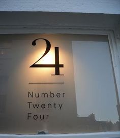 the number twenty four sign is displayed in a window