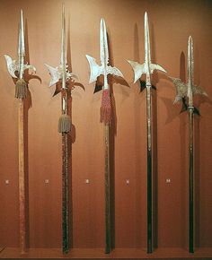 five different types of swords on display in a museum