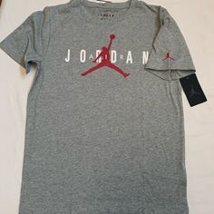 Nike Air Jordan Boy's T-Shirt . Brand New With Tag . Boy's Size : Xl (13-15 Yrs) Color : Dark Grey Heather . Short Sleeve Tee With Graphic . 60%Cotton 40% Polyester Air Jordans Girls, Jordan Tees, Jordan Shirt, Grey Jordans, Jordan Boys, Jordan Shorts, Jordan Outfit, Jordans Girls, Jordan Grey