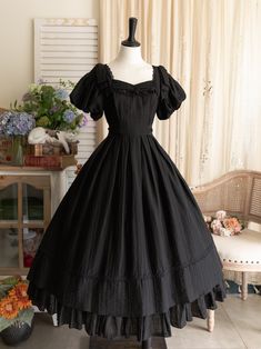 This price includes a dress and a black bowknot hairclip (not for sale).  Embrace timeless elegance with this enchanting Black Puff Sleeves Classic Lolita Princess Tea-Length Dress. Designed for the true Lolita aficionado, this dress features delicately puffed sleeves and a flattering tea-length skirt that exudes sophistication and charm. The back boasts a comfortable shirring detail, ensuring a perfect fit for all body types. Whether you're attending a tea party, a cosplay event, or simply indu Dark Tea Party Outfit, Vintage Dresses 50s 1950s Fashion Classy, Black Dress For Halloween, Vintage Tea Party Outfit, Victorian Black Dress, Black Witchy Dress, Black Princess Dress, Black Peasant Dress, Black Tea Length Dress