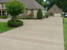 a driveway in front of a large house