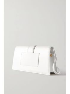 JACQUEMUS Le Bambino Long leather shoulder bag | NET-A-PORTER White Luxury Flap Bag With Gold-tone Hardware, Timeless White Flap Bag With Detachable Strap, White Evening Bag With Removable Pouch, White Top Handle Evening Bag With Removable Pouch, Designer White Flap Bag With Detachable Strap, Chic White Leather Evening Bag, Luxury White Top Handle Evening Bag, Luxury White Box Bag With Top Handle, White Satchel Evening Bag With Detachable Strap