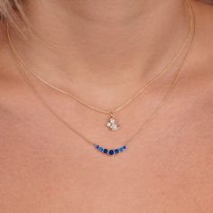 This stunning necklace features a delicate 14k gold chain with a graduated bezel design, adorned with beautiful blue sapphire gemstones. The pendant measures approximately 3/4 of an inch, making it the perfect size for everyday wear or special occasions. The combination of gold and sapphire creates a timeless and elegant look that will elevate any outfit. Dainty Sapphire Jewelry, Diamond And Sapphire Necklace, Sapphire Diamond Necklace, Sapphire Pendant Necklace, Blue Sapphire Necklace, Bezel Necklace, Jewellery Inspiration, Batman Arkham, Sapphire Pendant