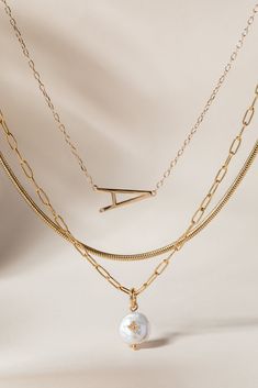 Layered looks are trending, and the luxurious Precious Elongated Initial Necklace is the perfect personal touch to your neck stack. This letter necklace is brilliantly crafted with a 14K gold-plated sterling silver chain and an elongated initial letter uniquely strung sideways. Whether you choose to wear your own initial or that of a cherished loved one, this necklace is a timeless piece that keeps your most treasured connections beautifully close to your heart. Initial Necklace Stack, Gold Sterling Silver Initial Necklace With Cable Chain, Gold Initial Pendant Necklace For Layering, Gold Initial Pendant Chain Necklace For Layering, Gold Minimalist Initial Necklace With Paperclip Chain, Minimalist Gold Initial Necklace With Paperclip Chain, Elegant Gold Name Necklace With Cable Chain, Gold Initial Necklace With Paperclip Chain For Everyday, Gold Initial Pendant Jewelry For Everyday Luxury