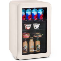 a mini fridge with four different types of drinks in it