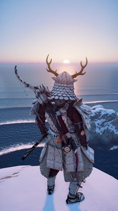 a man dressed in armor with horns and arrows standing on top of a snow covered hill