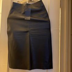 Black Leather Modern Black Pencil Skirt For Evening, Modern Black Midi Pencil Skirt, Modern Black Pencil Mini Skirt, Black Modern Lined Pencil Skirt, Modern Black Lined Pencil Skirt, Classic Black Mini Skirt For Party, Modern Black Mini Skirt, Classic Black Skirt For Night Out, Modern Black Party Skirt