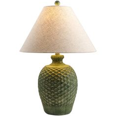 a green table lamp with a white shade on the base and a beige fabric lampshade