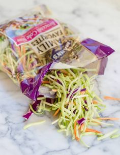 shredded veggies are sitting on a marble counter top