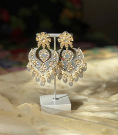 A perfect grey kundan/chandbali earring for your next event! Luxury Meenakari Temple Jewelry Pearl Earrings, Silver Kundan Danglers For Festivals, Silver Kundan Danglers For Festive Occasions, Silver Kundan Necklace With Gota Work For Gift, Gold Bridal Earrings With Mirror Work For Parties, Silver Kundan Chandbali Danglers, Traditional Silver Kundan Chandelier Earrings, Bollywood Style Kundan Pearl Earrings With Meenakari, Bollywood Bridal Earrings With Mirror Work For Gift