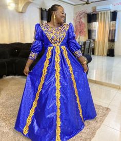 Description: This magnificent custom African dress is perfect for any occasion you want to look your best. It includes 3 pieces (Full dress, wrap-around or Skirt and head-tie).   Important Note: For broderie mix with bazin and garniture mix clothes only: Depending on the availability of the( fabric) / Garnitures (TRIMS) may be different than the one in the pictured. However, the dress will be sewn exactly in the style and colors shown. You can always request to see the fabrics or trims before we start by sending us a message along with your order. PROCESSING: We usually take 6- 8 BUSINESS DAYS to make the dress. SHIPPING: We use DHL shipping with tracking and text update. (3 to 5 days) SIZING: What we need from you We have a sizing Chart in the images. Scroll to the right. (Providing your Royal Style Fitted Fancy Dress, Royal Fitted Fancy Dress, Royal Fitted Dress For Formal Occasions, Royal Blue Fitted Traditional Dress, Fitted Royal Blue Traditional Dress, Gold Long Sleeve Fancy Dress, Gold Long Sleeve Dress For Fancy Occasion, Royal Evening Dress For Festive Occasions, Elegant Gold Dress For Fancy Dress Occasions