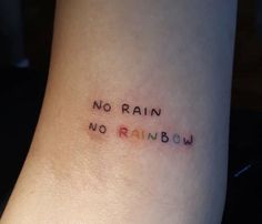 a tattoo saying no rain, no rainbow