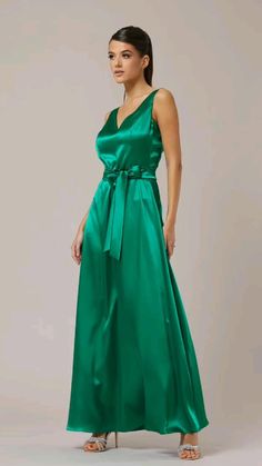 Silk V-neck Maxi Dress For Prom, Green V-neck Gown For Summer, Modal Satin V-neck Party Dress, Green V-neck Maxi Dress For Prom, Satin Dress For Wedding Guest During Prom Season, Silk A-line Prom Dress, Green Satin A-line Dress, Satin Finish Sleeveless Dress For Wedding Guest, Bias Cut Modal Satin Maxi Dress